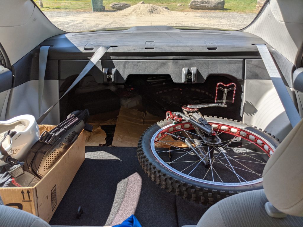 Echo trials bike in the trunk of my Toyota Corolla