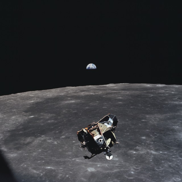 Apollo 11 lunar module returns from the moon's surface to rendezvous with the command module while Earth rises in the background. Photo courtesy of NASA.