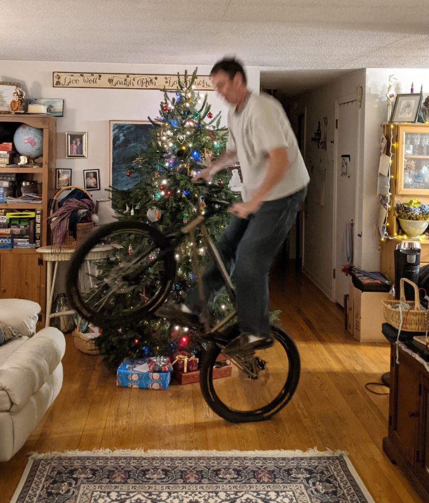 Classic trials biking move - balancing on the rear wheel (in front of the Christmas tree in the living room)