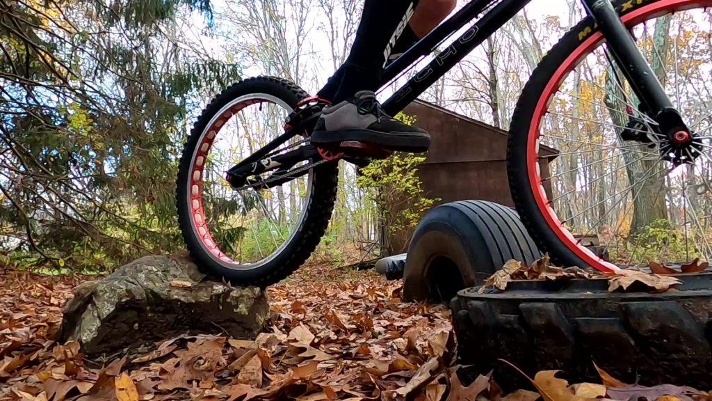Preparing to gap from a rock to a tire