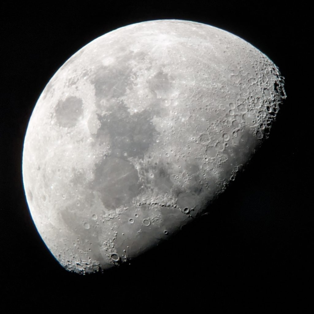 Gibbous moon, photographed through a telescope using a smartphone camera
